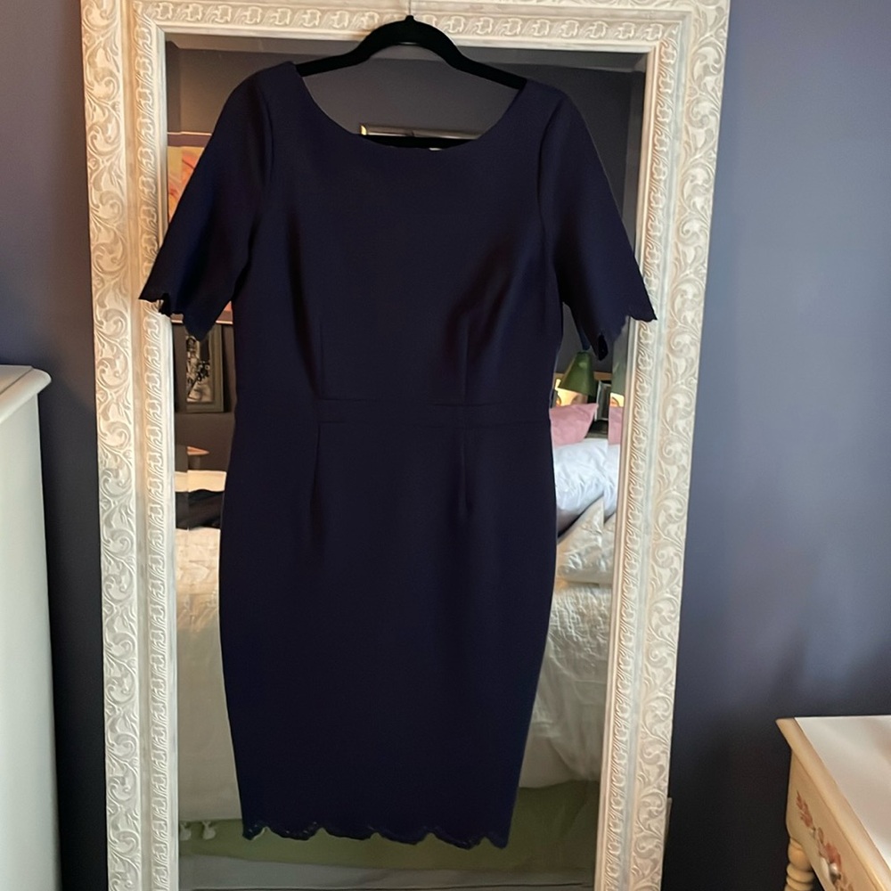 Navy Boden dress with scalloped eyelet detail on sleeves and hem